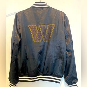 Washington Commanders women’s black bomber jacket with bedazzled W.